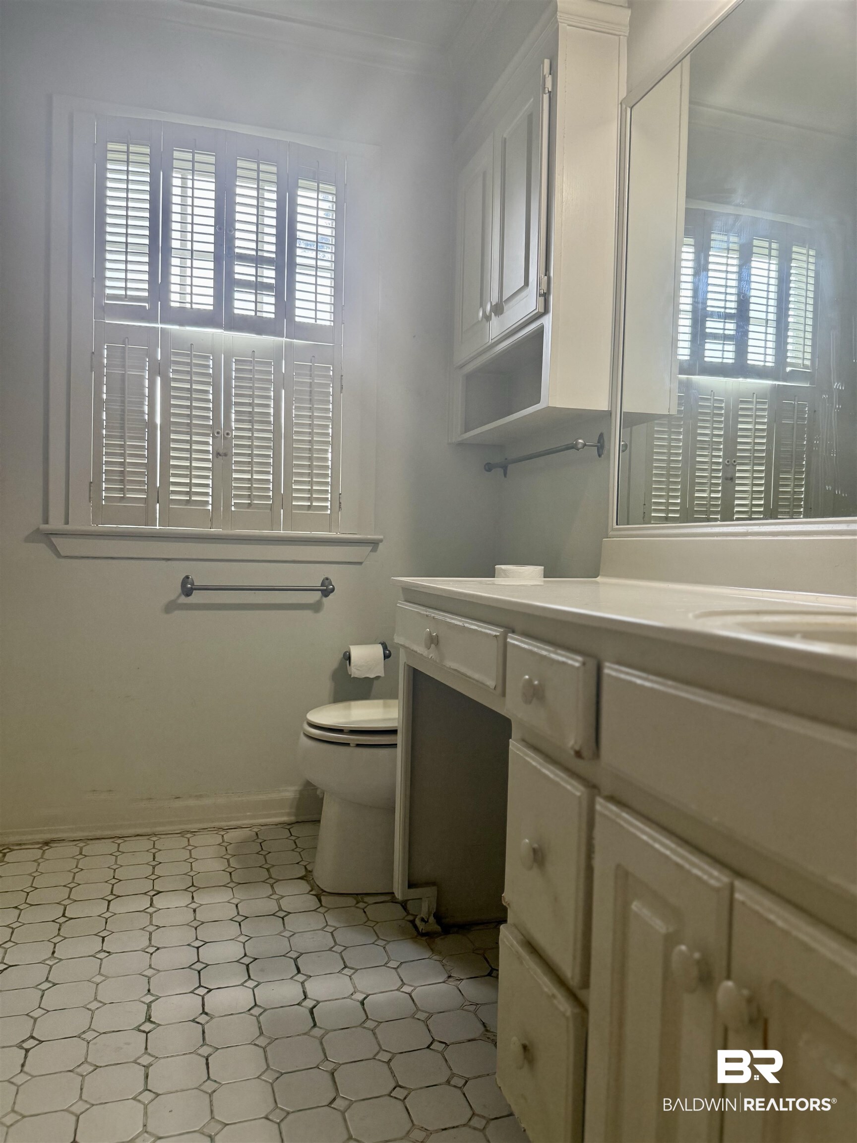 1412 Poplar Avenue Brewton, AL 36426 - Photo 23 of 32 Bathroom featuring tile patterned floors, crown molding, vanity, and toilet