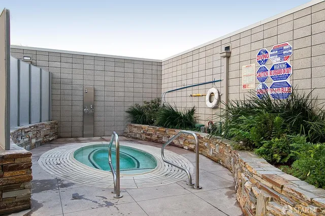 a view of a patio with couches and potted plants