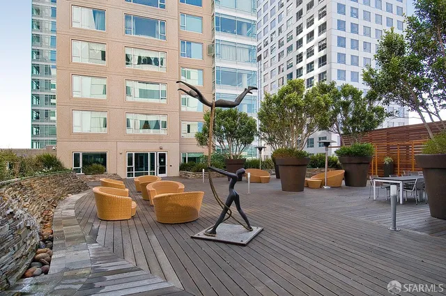 a view of a patio on the deck in front of house
