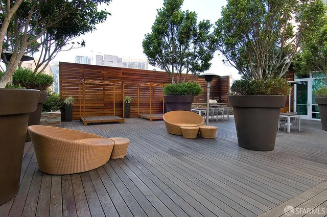 a living room with fireplace furniture and a large window