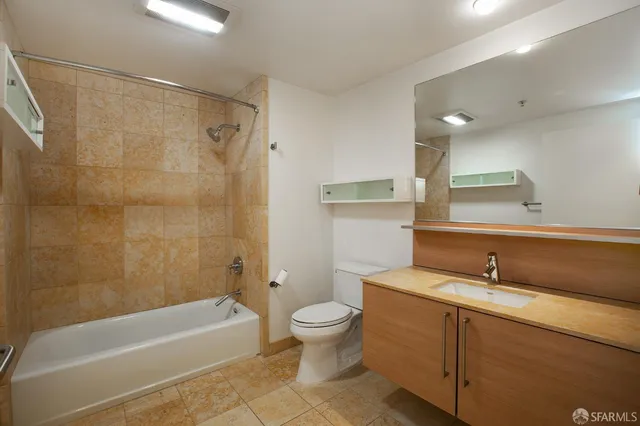 a bathroom with a sink a toilet and a bathtub