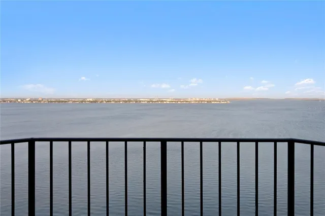 a view of a kitchen with kitchen island a counter tops pace a sink appliances and a dining table view