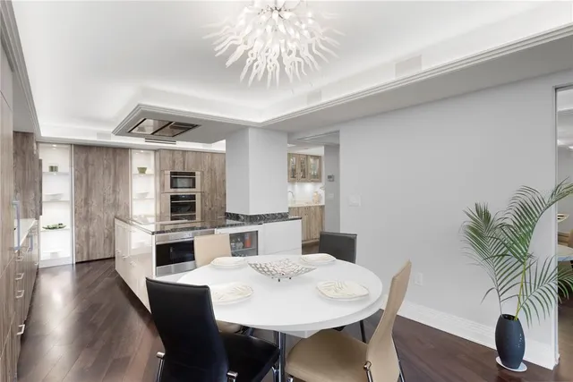 a bedroom with a bed and a potted plant