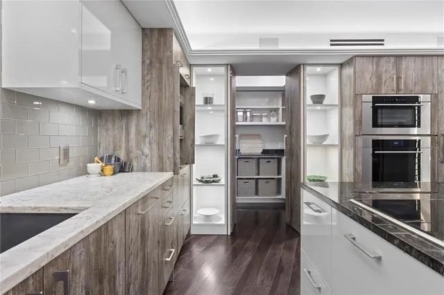 a view of a livingroom with wooden floor and flat screen tv