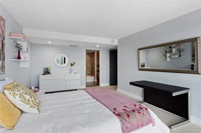 a living room with furniture and large windows