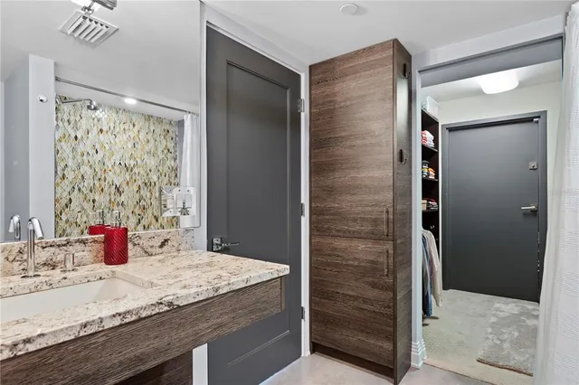 a view of a patio with table and chairs and potted plants