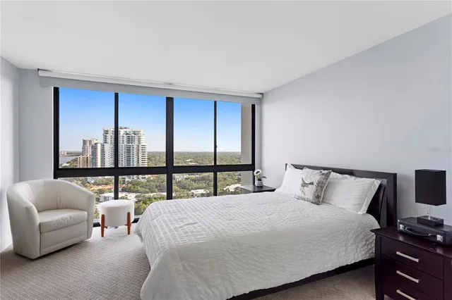 a front view of a house with swimming pool having outdoor seating