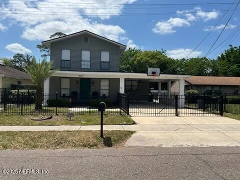 a house with palm tree in front of it