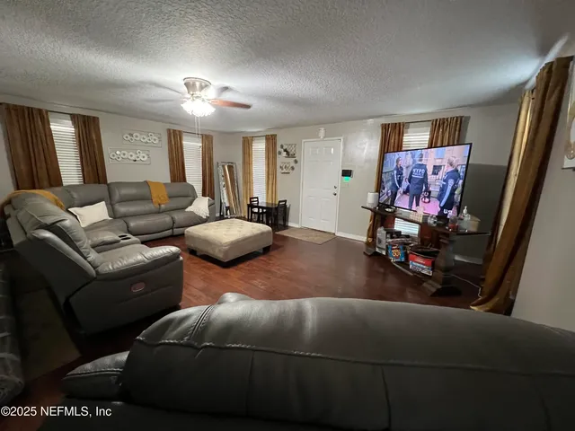 a kitchen with a stove a sink and a refrigerator