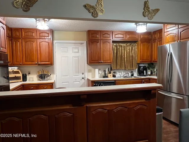 a bathroom with a toilet and a shower curtain