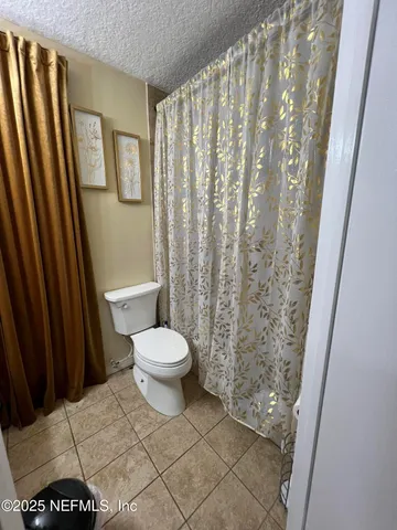 a bathroom with a toilet and a sink