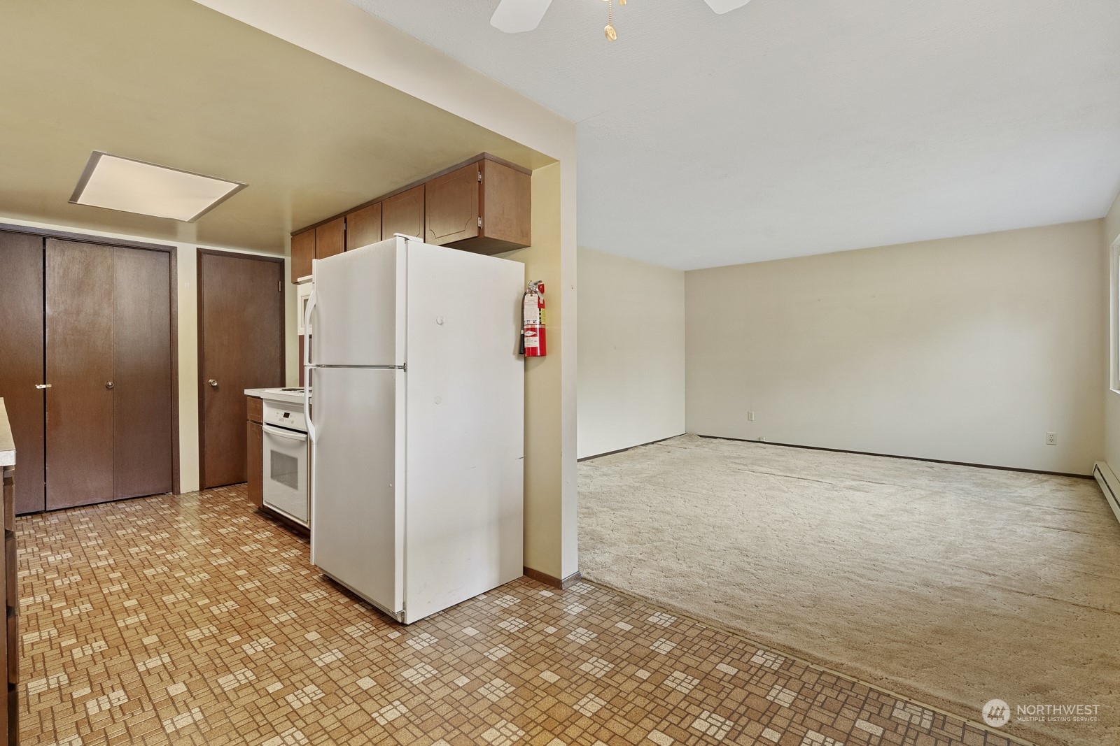 19211 3rd Drive Southeast Bothell, WA 98012 - Photo 14 of 37 a view of a refrigerator in kitchen and white cabinets