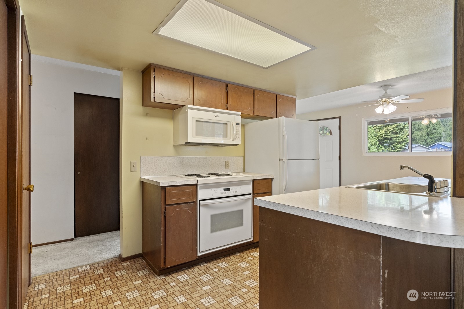 19211 3rd Drive Southeast Bothell, WA 98012 - Photo 15 of 37 a kitchen with stainless steel appliances cabinets and wooden floor