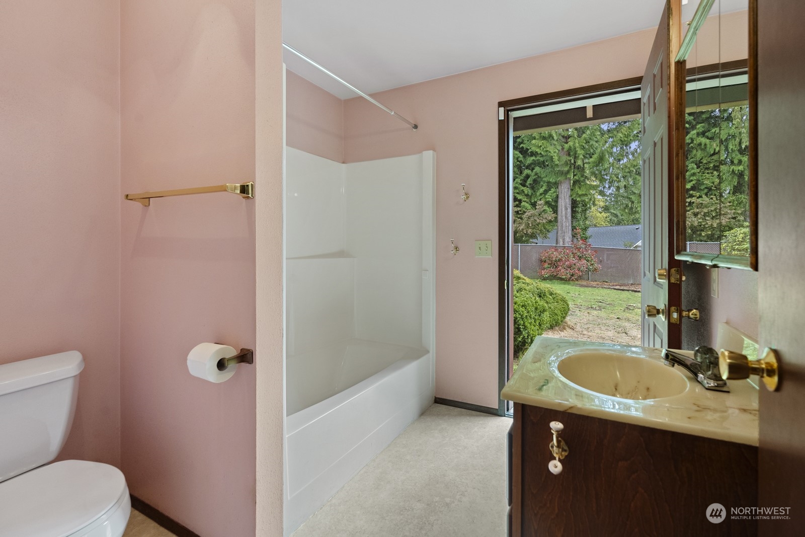 19211 3rd Drive Southeast Bothell, WA 98012 - Photo 27 of 37 a bathroom with a sink a toilet a mirror and shower