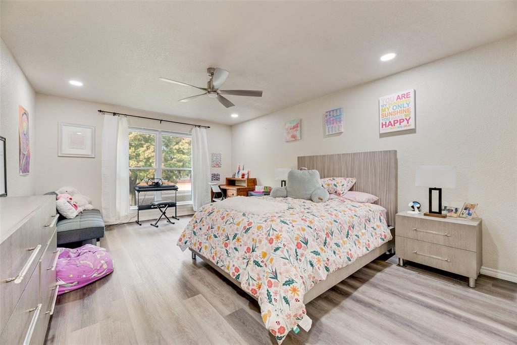 61 1 Main Place Benbrook, TX 76126 - Photo 17 of 21 a bedroom with bed and a window