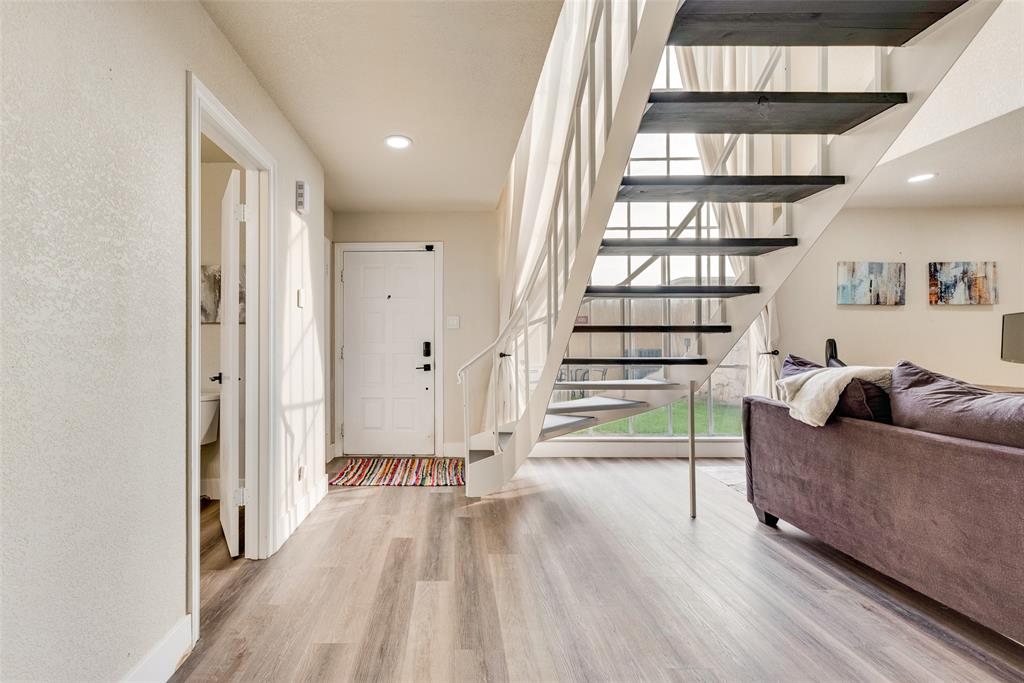 61 1 Main Place Benbrook, TX 76126 - Photo 4 of 21 a living room with furniture and a wooden floor