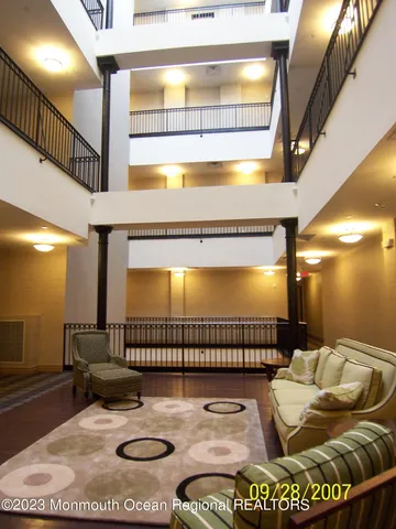 a bathroom with a mirror and a rug