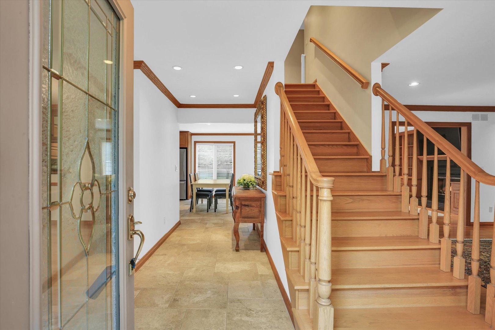 2706 North Salisbury Court Champaign, IL 61821 - Photo 2 of 60 a view of a hallway with wooden floor and staircase