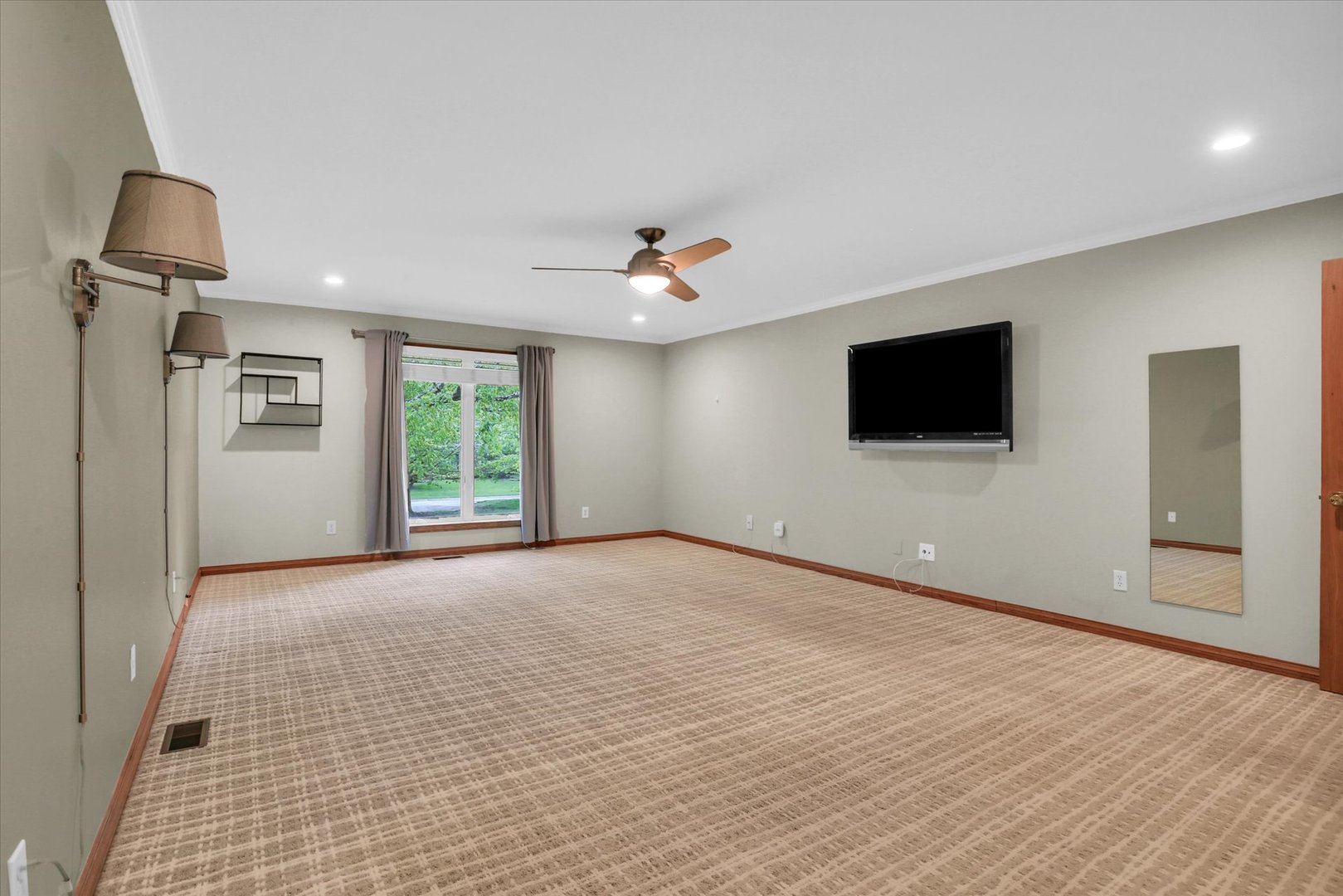 2706 North Salisbury Court Champaign, IL 61821 - Photo 33 of 60 a view of an empty room with a flat screen tv and a window