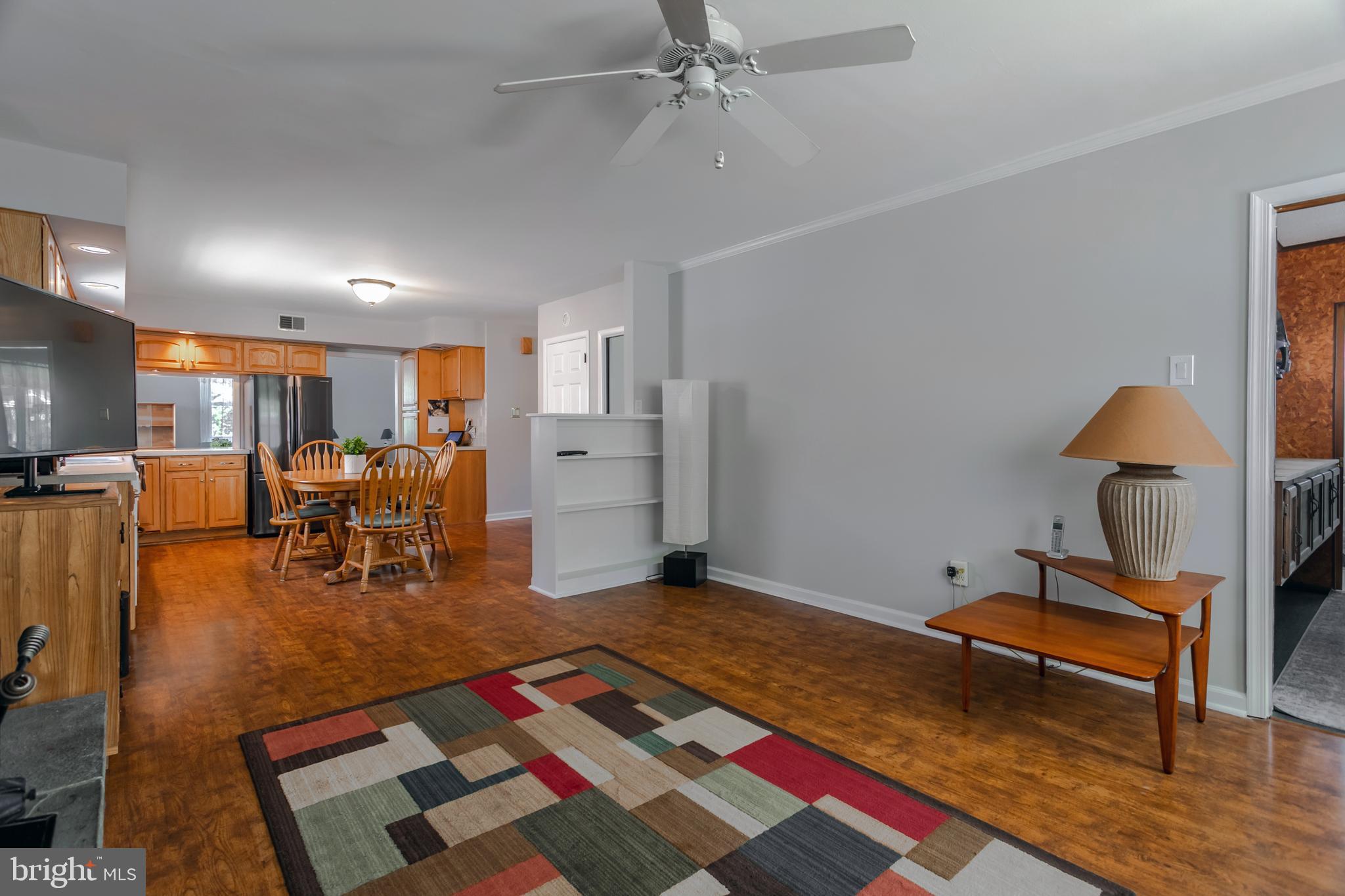 29 Strathmore Road Havertown, PA 19083 - Photo 15 of 34 a living room with furniture and a dining table with wooden floor