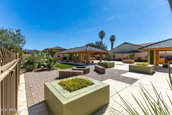 a swimming pool with outdoor seating and yard