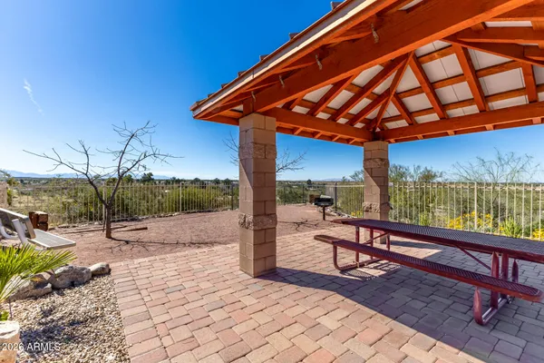 a view of a house with swimming pool and sitting area