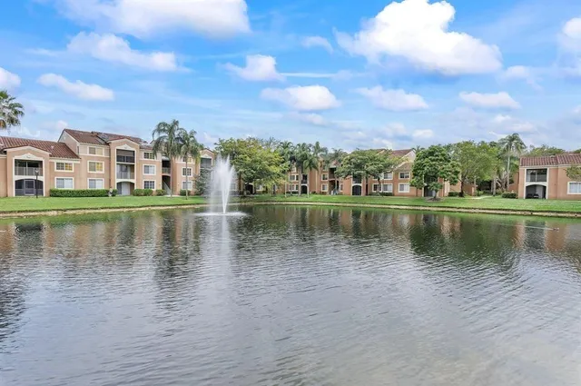 a view of a lake with a building in the background