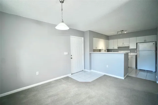a view of a kitchen with a sink cabinets and wooden floor