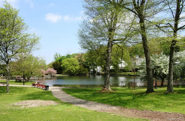 a view of a lake with a house in the background