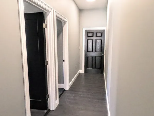 a view of a hallway with hallway and closet