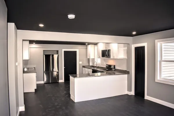 a view of a living room and a wooden floor