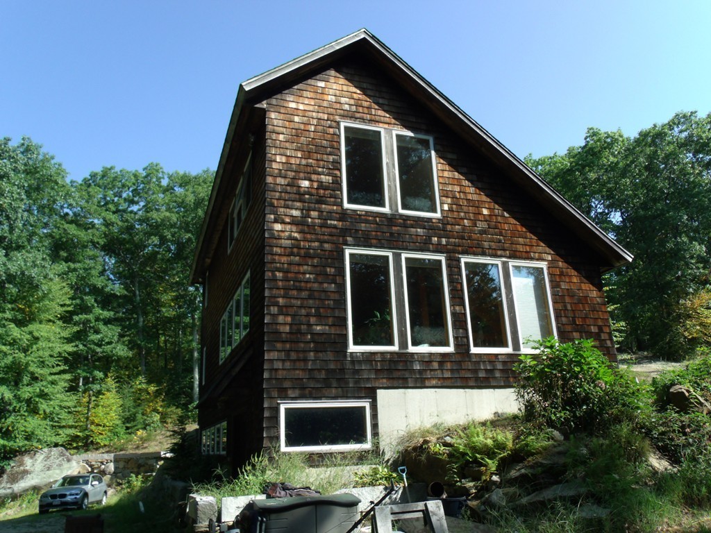95 May Hill Road Monson, MA 01057 - Photo 4 of 22 a front view of a house with a yard
