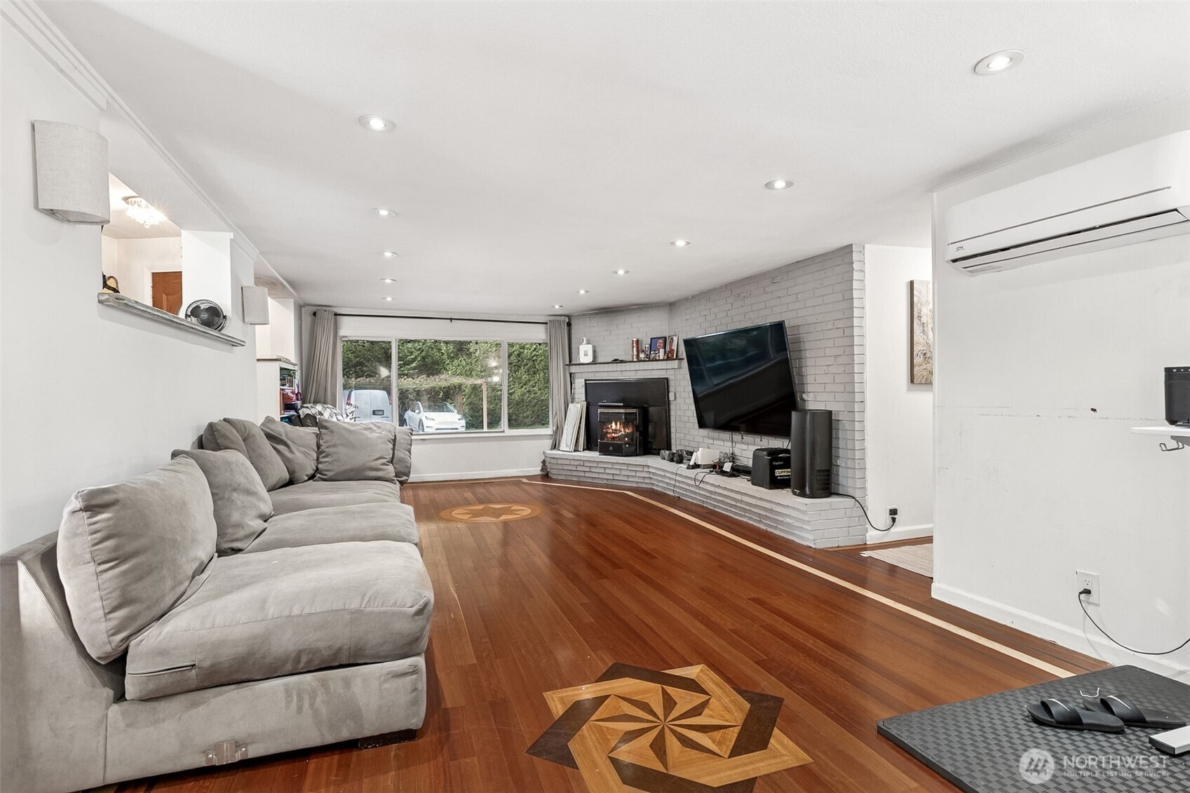 13718 Macadam Road South Tukwila, WA 98168 - Photo 2 of 12 a living room with furniture and a flat screen tv