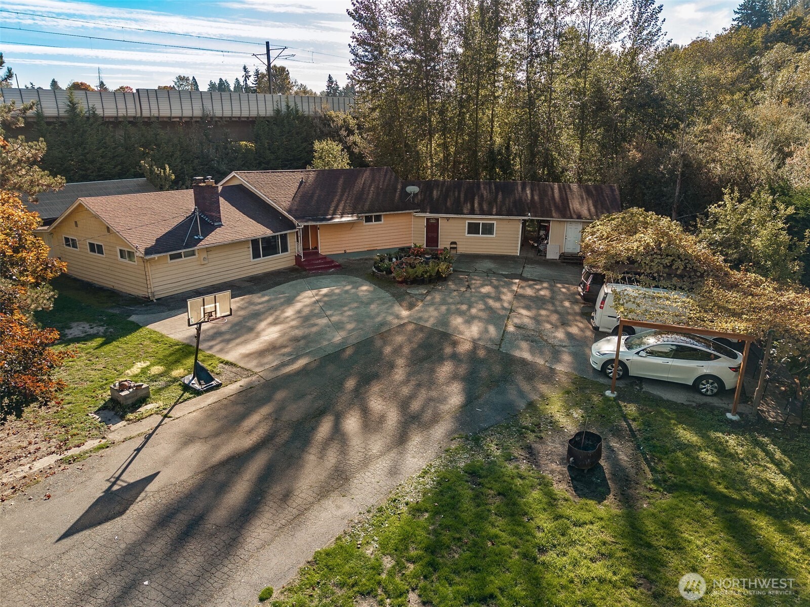 13718 Macadam Road South Tukwila, WA 98168 - Photo 9 of 12 a swimming pool with some trees in the background