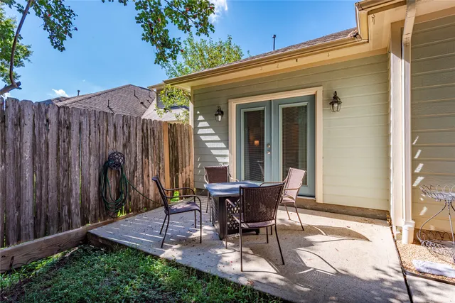 a view of a dinning tables in backyard of the house