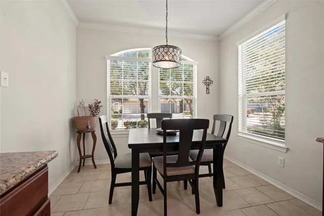 a view of a dining room with furniture window and outside view