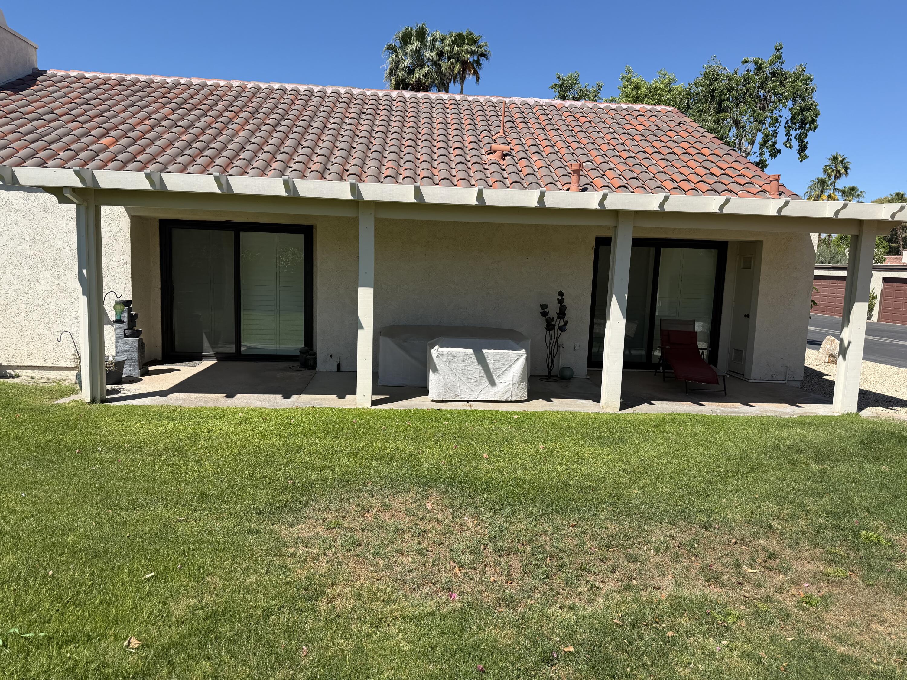 422 Forest Hills Drive Rancho Mirage, CA 92270 - Photo 2 of 3 a view of a house with a garden