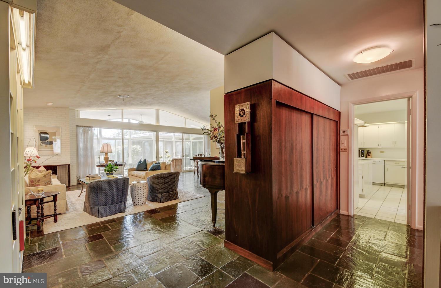 Foyer Area, Living Room, Hall to Kitchen and Den