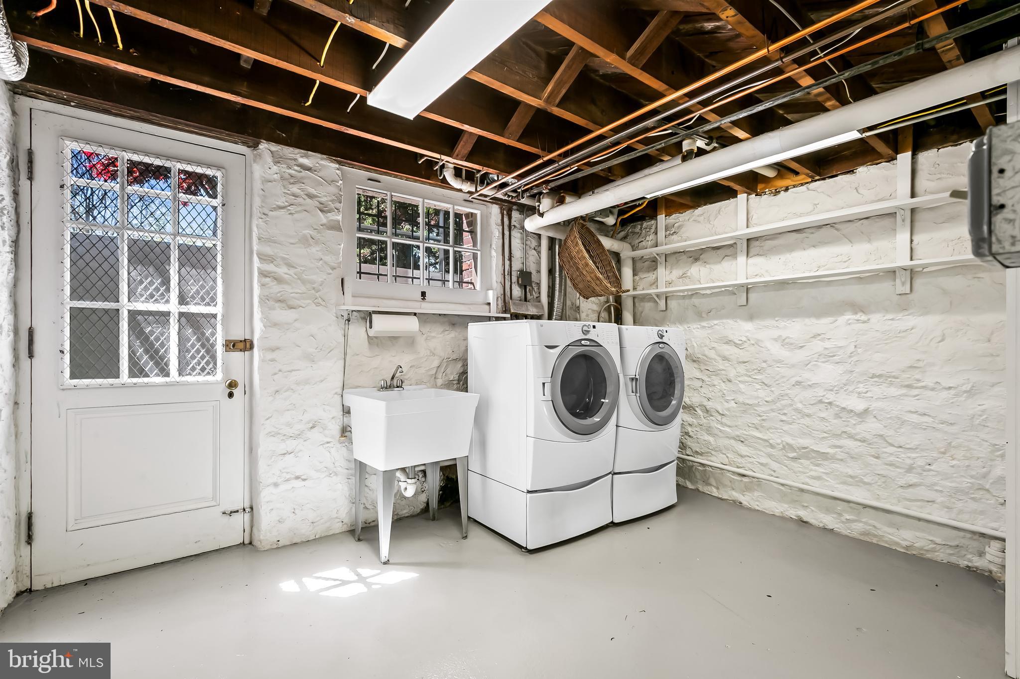 7 Wendover Road Baltimore, MD 21218 - Photo 69 of 95 Laundry area in basement with access to backyard