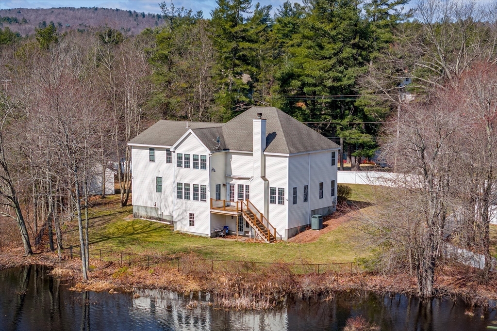 5 Gatehouse Road Westminster, MA 01473 - Photo 36 of 37 a view of a house with a yard and large tree