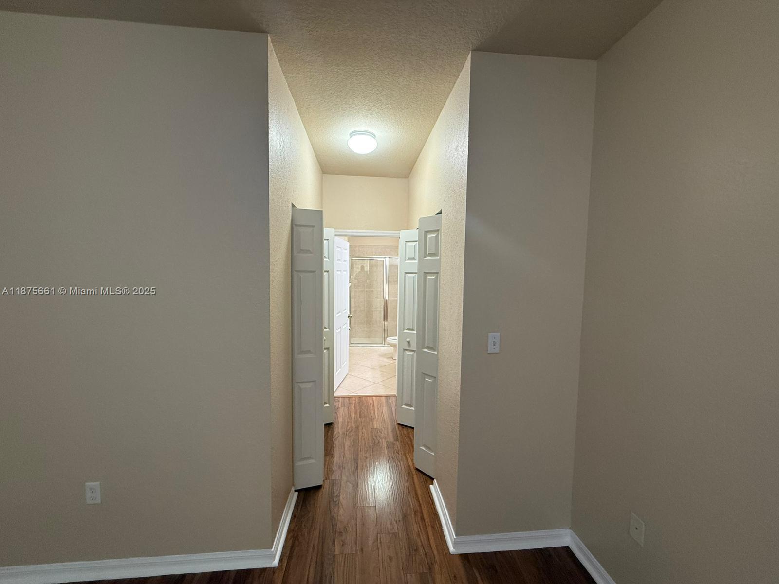 13218 Southwest 44th Street, Unit 11106 Miramar, FL 33027 - Photo 13 of 23 a view of hallway with wooden floor