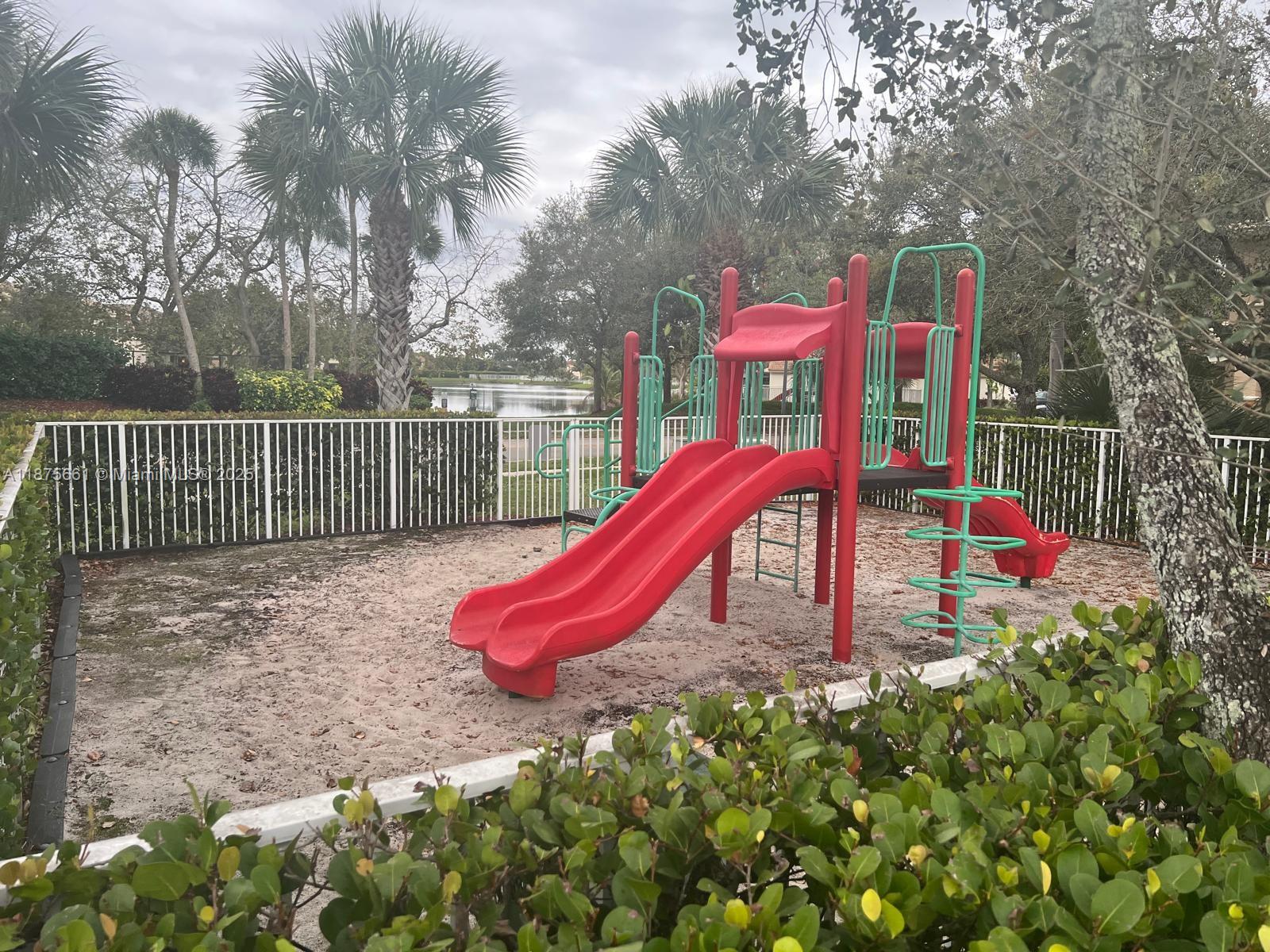 13218 Southwest 44th Street, Unit 11106 Miramar, FL 33027 - Photo 23 of 23 a view of a park with iron fence