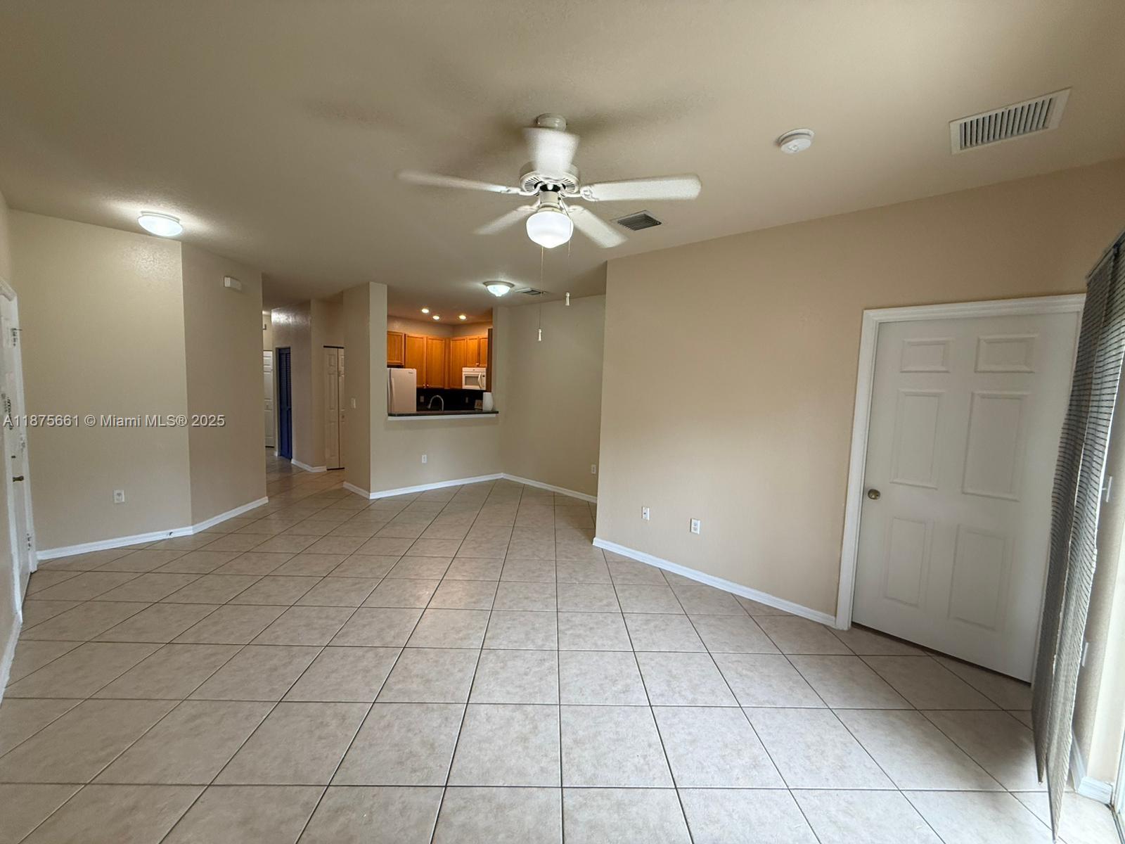 13218 Southwest 44th Street, Unit 11106 Miramar, FL 33027 - Photo 3 of 23 a view of a livingroom with a ceiling fan and window