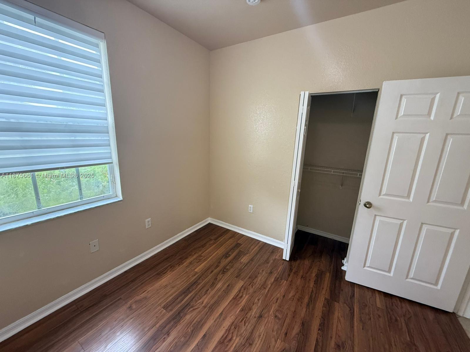 13218 Southwest 44th Street, Unit 11106 Miramar, FL 33027 - Photo 9 of 23 a view of a room with wooden floors and stairs