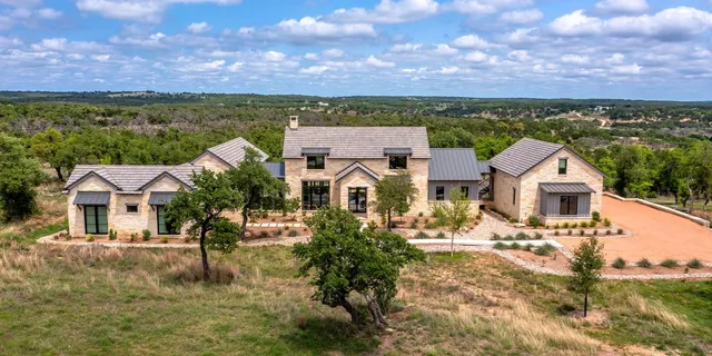 an aerial view of a house with a garden