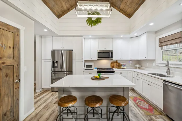 a living room with a fireplace and a flat screen tv