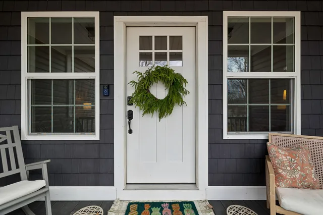 a view of a livingroom with furniture window and wooden floor