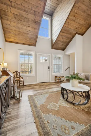 a bathroom with a granite countertop sink a mirror and vanity