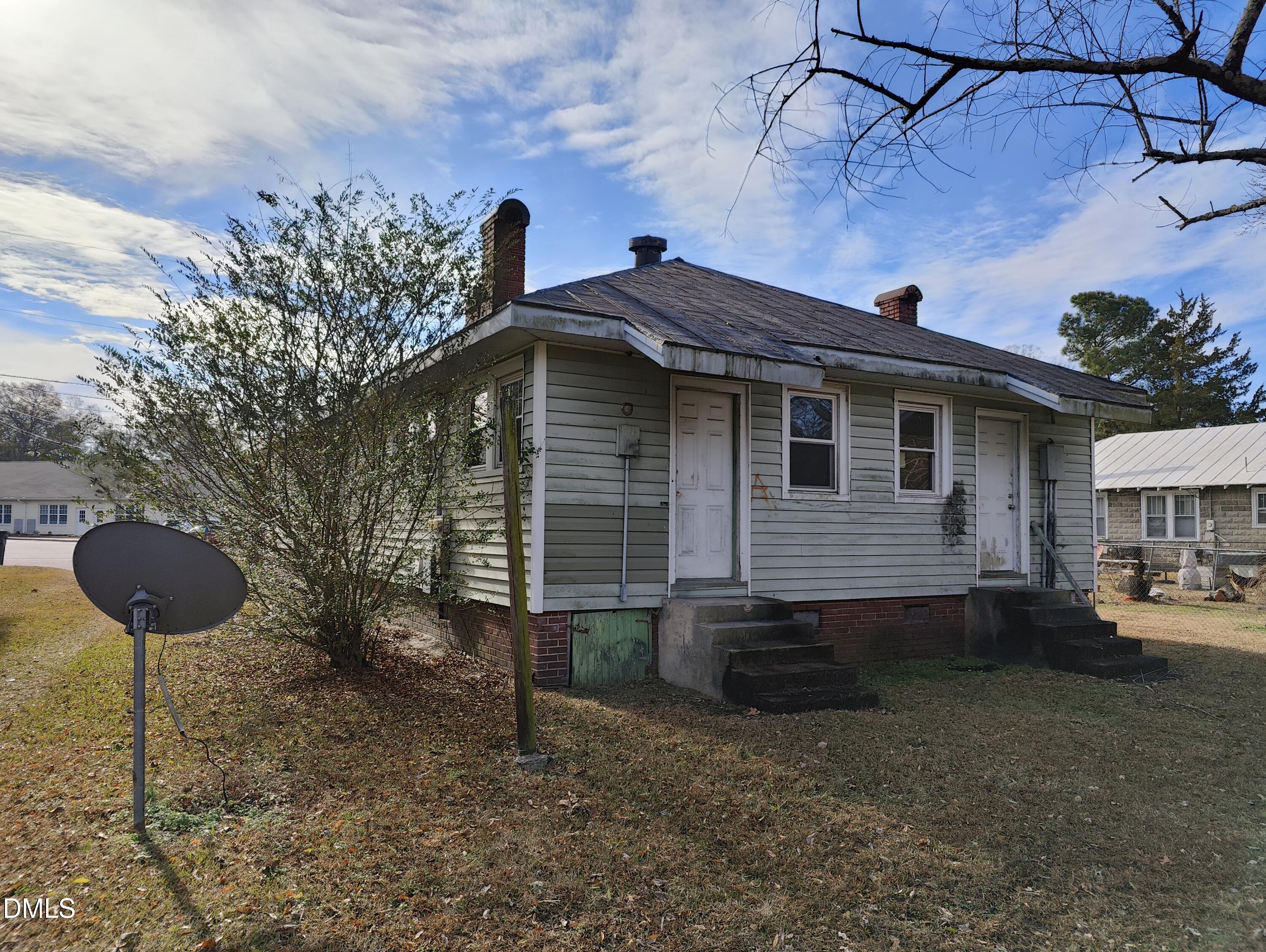 314-316 High Street Rocky Mount, NC 27803 - Photo 2 of 7 a view of a house with a yard and a fire pit