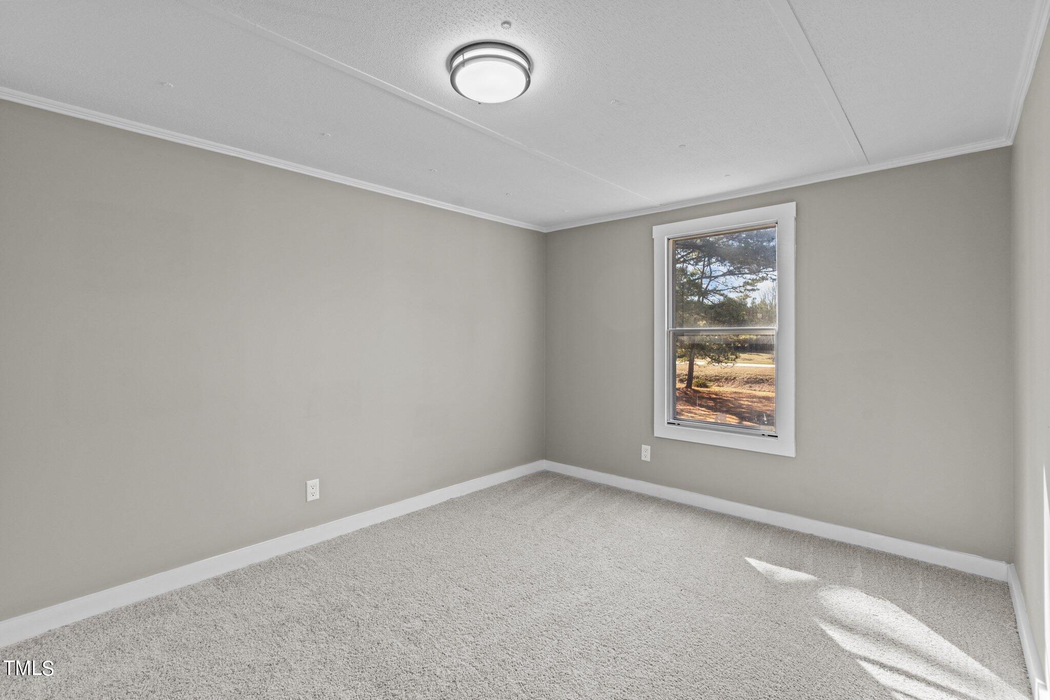 365 Rev Henderson Road Henderson, NC 27537 - Photo 17 of 48 an empty room with windows